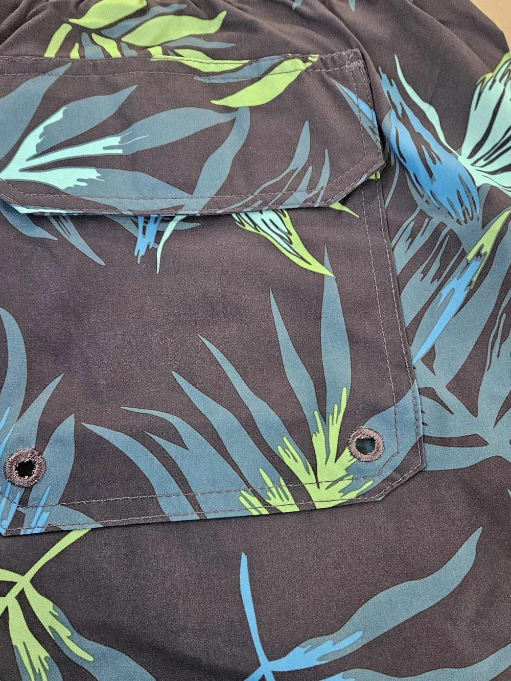 Kanu Surf Navy Swim Trunks with Blue & Green Tropical Leaves